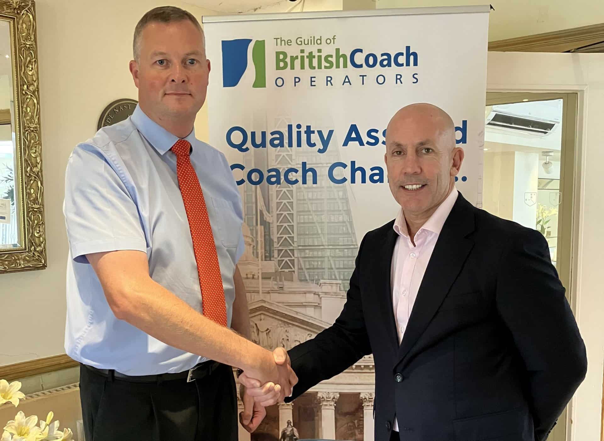 phil hitchen of belle vue manchester, right, with anthony winson, chairman of the guild of british coach operators landscape